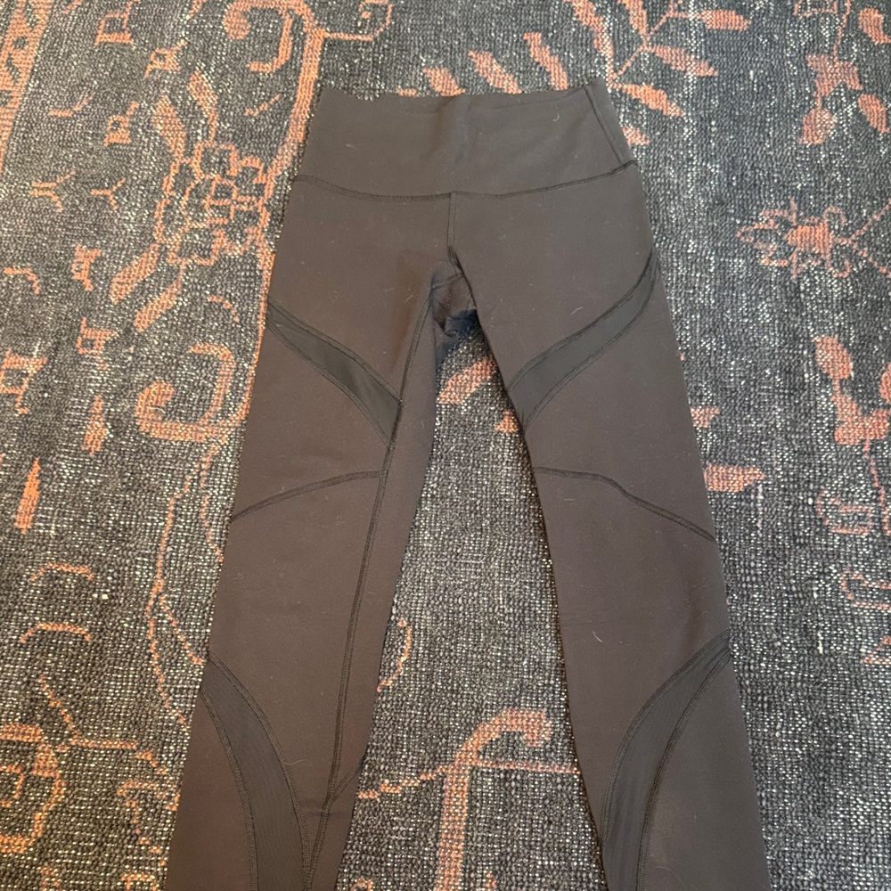 LULULEMON Black High-Waisted Leggings with sheer panels! Size 6. Worn once